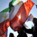 Demonstators wave Iranian opposition fla