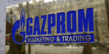 The logo of Gazprom marketing department is seen in front the office located on the Champs Elysees in Paris