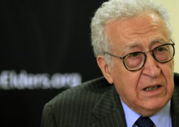 Diplomat Lakhdar Brahimi speaks with former U.S. President Jimmy Carter (not pictured) during a joint news conference in Khartoum