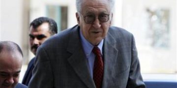 UN-Arab League peace envoy for Syria Lakhdar Brahimi arrives for a joint news conference in Amman