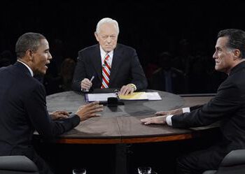 U.S. President Barack Obama makes a point while answering a question from moderator Bob Schieffer as Republican presidential nominee Mitt Romney listens during the final U.S. presidential debate in Boca Raton