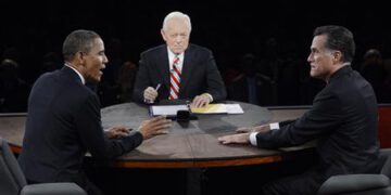 U.S. President Barack Obama makes a point while answering a question from moderator Bob Schieffer as Republican presidential nominee Mitt Romney listens during the final U.S. presidential debate in Boca Raton