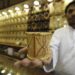 Mahdi al-Mehri, 28, saudi jeweller displays gold bangle in a jewellery shop at the surrounding area of the Grand Mosque during the annual haj pilgrimage in the holy city of Mecca