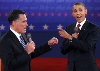 Republican presidential nominee Romney and U.S. President Obama answer a question at the same time during the second U.S. presidential campaign debate in Hempstead