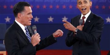 Republican presidential nominee Romney and U.S. President Obama answer a question at the same time during the second U.S. presidential campaign debate in Hempstead