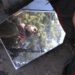 A member of the Free Syrian Army is reflected in a mirror in a house they use as a base in Haram town, Idlib Governorate