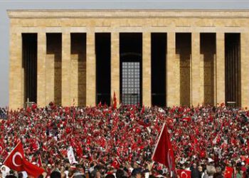 Demonstrators wave flags and shout slogans as they arrive at the Anitkabir in central Ankara