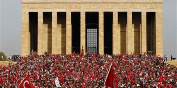 Demonstrators wave flags and shout slogans as they arrive at the Anitkabir in central Ankara