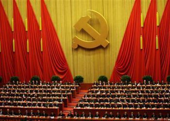 Delegates attend the closing session of 18th National Congress of the Communist Party of China at the Great Hall of the People in Beijing