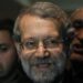 Iran's Parliament speaker Ali Larijani smiles after speaking to journalists at Beirut international airport