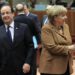 France's President Hollande walks past Germany's Chancellor Merkel during European Union leaders summit in Brussels