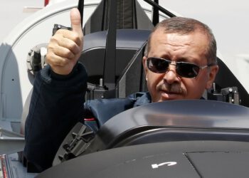 Turkish Prime Minister Tayyip Erdogan gives a thumbs-up sign from the cockpit of the Turkish Primary and Basic Trainer Aircraft "Hurkus" during a ceremony at the Turkish Aerospace Industries in Ankara