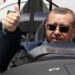 Turkish Prime Minister Tayyip Erdogan gives a thumbs-up sign from the cockpit of the Turkish Primary and Basic Trainer Aircraft "Hurkus" during a ceremony at the Turkish Aerospace Industries in Ankara