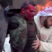 A bleeding man emerges from a bombed petrols station in Damascus