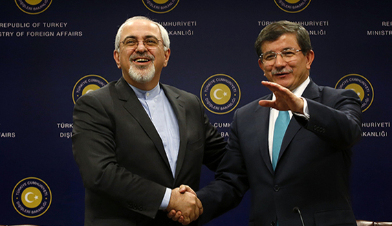 Iranian Foreign Minister Zarif shakes hands with his Turkish counterpart Davutoglu after a news conference in Ankara
