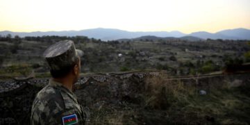 An Azerbaijani soldier inspects the city of Jabrayil, where Azerbaijani forces regained control during the fighting over the occupied Karabakh, Azerbaijan. October 16, 2020. (Reuters)