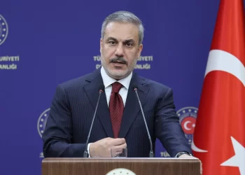 Foreign Minister Hakan Fidan speaking at a press conference.