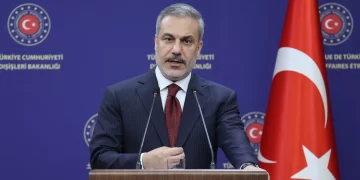 Foreign Minister Hakan Fidan speaking at a press conference.